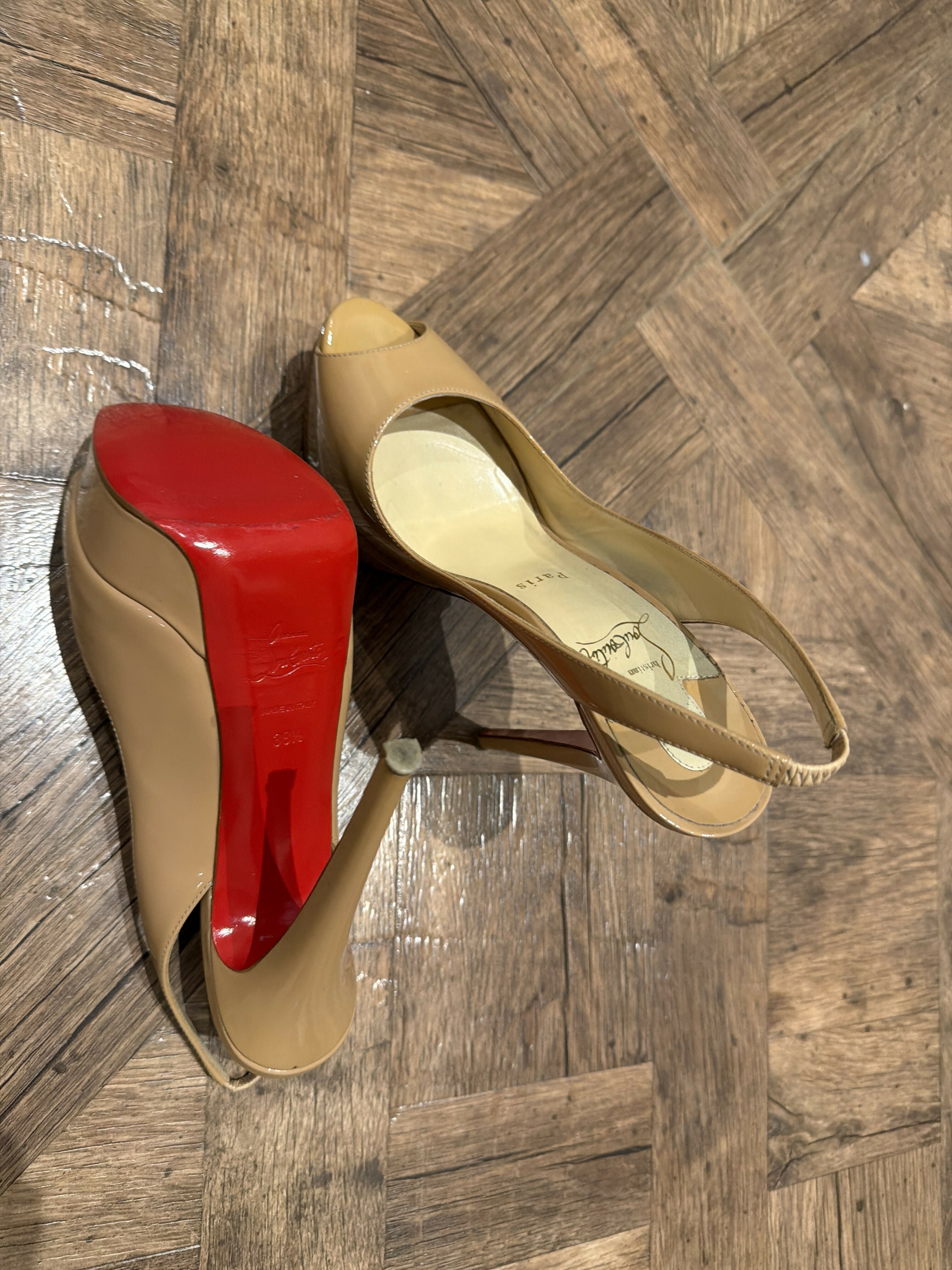 Nude patent leather peep-toe sling-back pumps with red sole — Christian Louboutin | Endless UAE