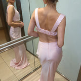 Elegant pink backless evening gown with sculptural bralette straps and floor-length silhouette — By Keara | Endless UAE