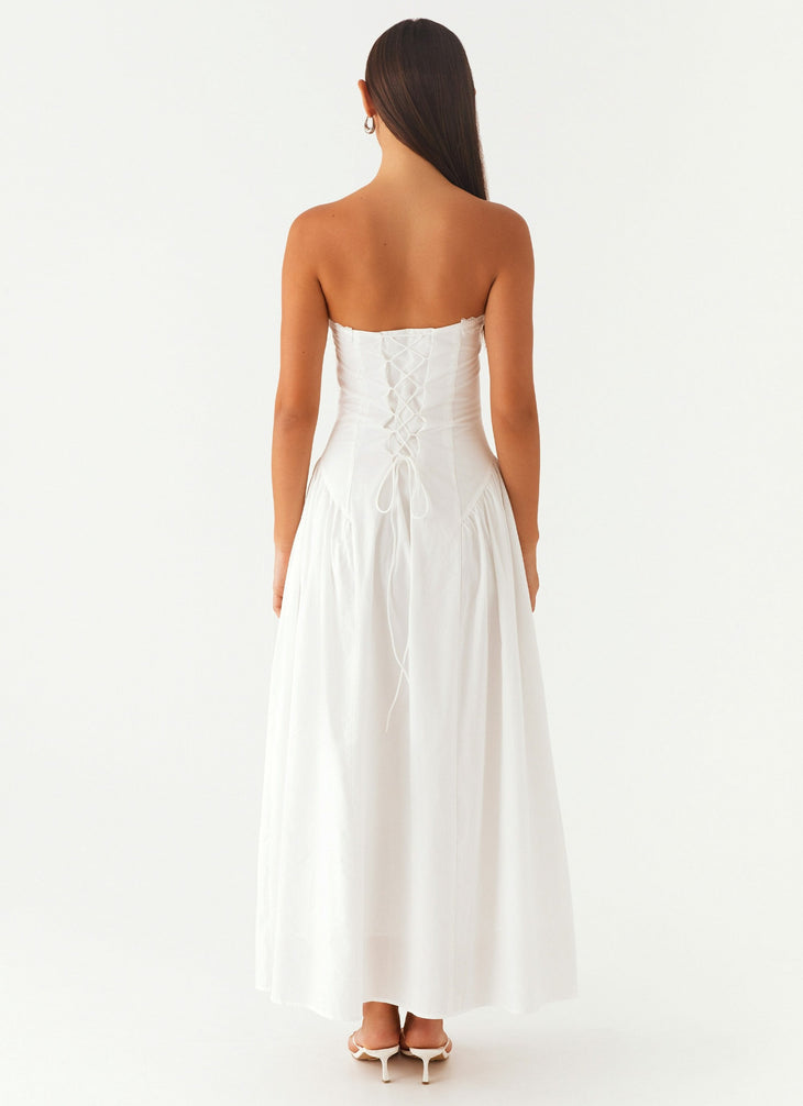 Woman wearing white strapless maxi dress with tie detail — Peppermayo | Endless UAE