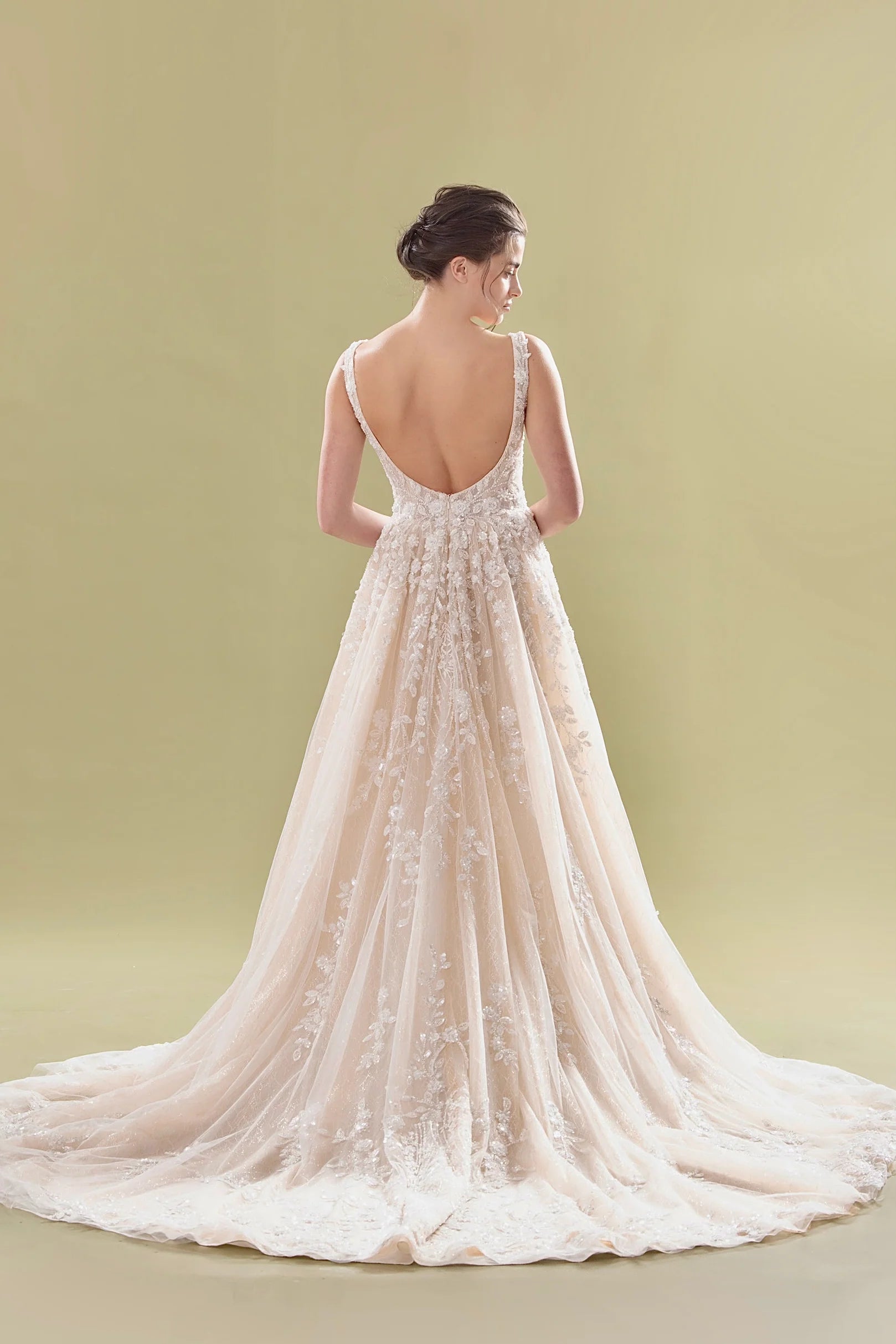 Elegant A-line bridal gown with lace appliqué, low scoop back, and flowing cathedral train — Teresa Atelier | Endless UAE