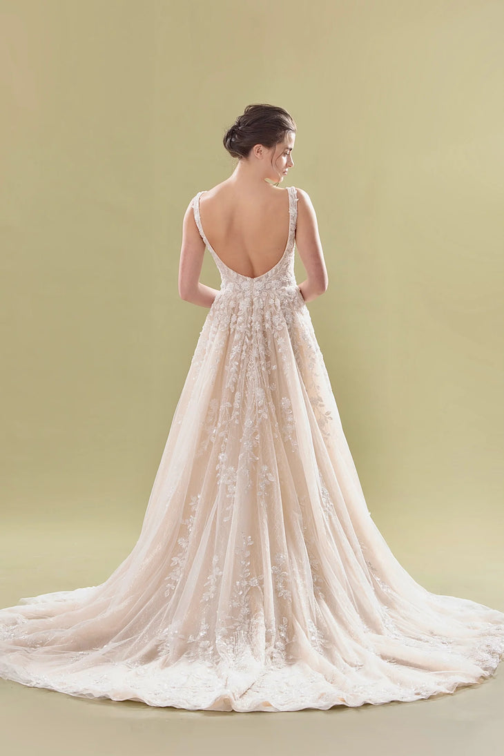 Elegant A-line bridal gown with lace appliqué, low scoop back, and flowing cathedral train — Teresa Atelier | Endless UAE
