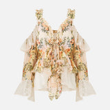 Floral ruffle cold-shoulder blouse with cream high-waisted scalloped shorts — Camilla | Endless UAE