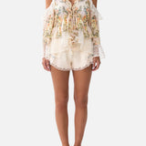 Floral ruffle cold-shoulder blouse with cream high-waisted scalloped shorts — Camilla | Endless UAE