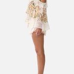 Floral ruffle cold-shoulder blouse with cream high-waisted scalloped shorts — Camilla | Endless UAE