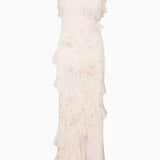 Woman modeling a cream floral ruffled maxi dress with delicate pastel details — LoveShackFancy | Endless UAE