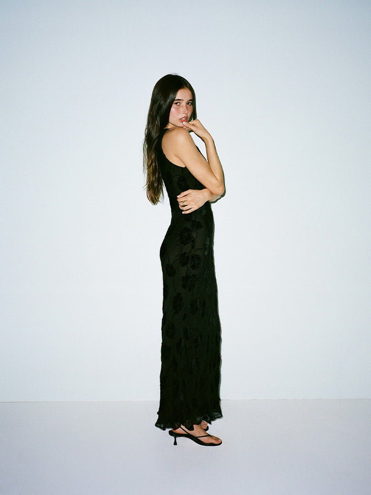 Black floral jacquard sleeveless maxi dress with side cutouts — Realisation Par | Endless UAE