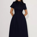 Woman wearing navy cotton denim collared midi dress with short sleeves — Endless | Endless UAE