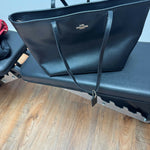 Black leather tote bag with dual handles and Coach branding — Coach | Endless UAE