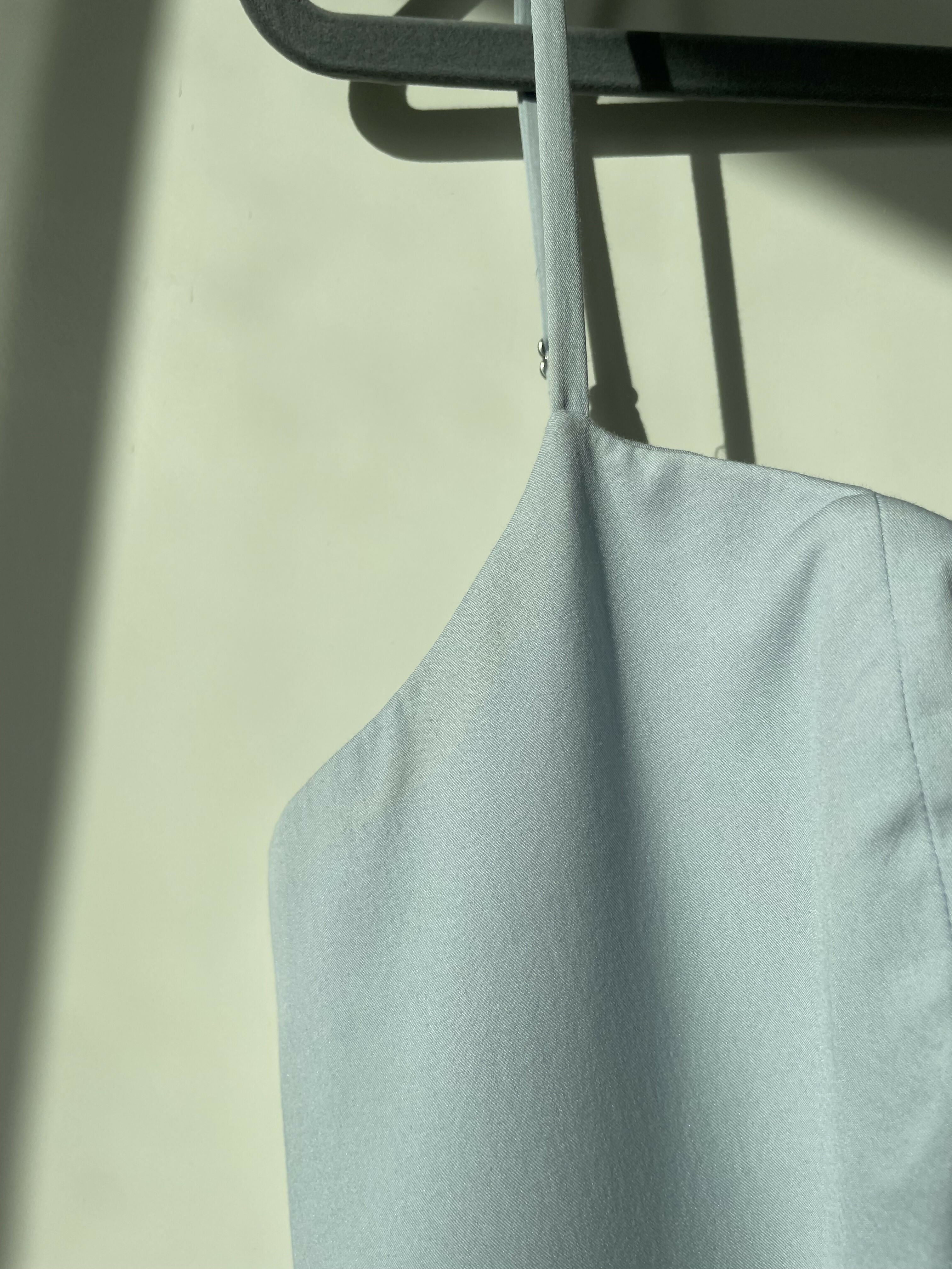 Woman wearing light blue sleeveless midi dress with corset top and full skirt — Endless | Endless UAE
