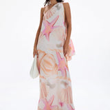 Woman wearing pastel pink and peach Bohemia Maxi Dress with abstract star print — Cin Cin | Endless UAE