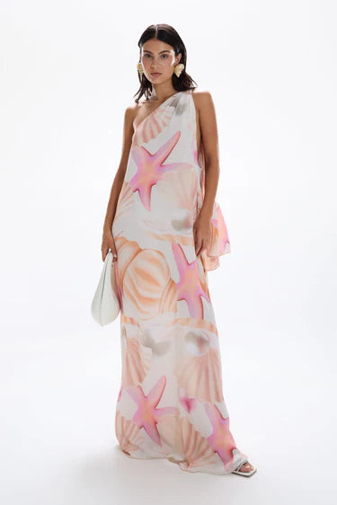 Woman wearing pastel pink and peach Bohemia Maxi Dress with abstract star print — Cin Cin | Endless UAE