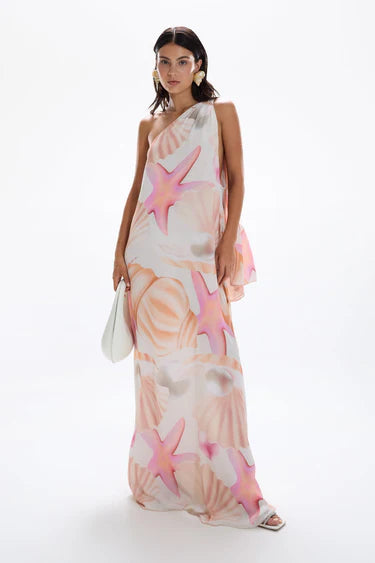 Woman wearing pastel pink and peach Bohemia Maxi Dress with abstract star print — Cin Cin | Endless UAE