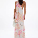 Woman wearing pastel pink and peach Bohemia Maxi Dress with abstract star print — Cin Cin | Endless UAE