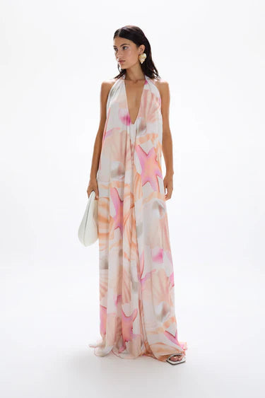 Woman wearing pastel pink and peach Bohemia Maxi Dress with abstract star print — Cin Cin | Endless UAE