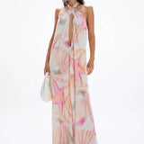 Woman wearing pastel pink and peach Bohemia Maxi Dress with abstract star print — Cin Cin | Endless UAE