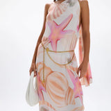 Woman wearing pastel pink and peach Bohemia Maxi Dress with abstract star print — Cin Cin | Endless UAE