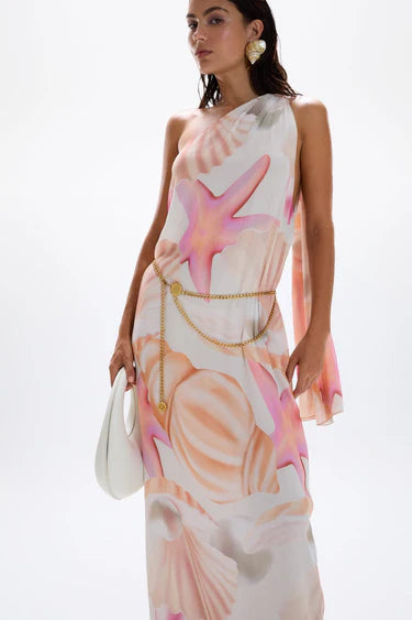 Woman wearing pastel pink and peach Bohemia Maxi Dress with abstract star print — Cin Cin | Endless UAE