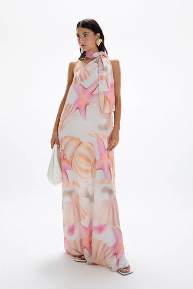 Woman wearing pastel pink and peach Bohemia Maxi Dress with abstract star print — Cin Cin | Endless UAE