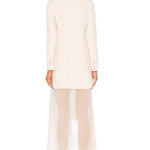 Rear view of woman wearing cream Bonita Tux Dress with sheer wide-leg pants and button-detailed sleeves — Haute Hippie | Endless UAE