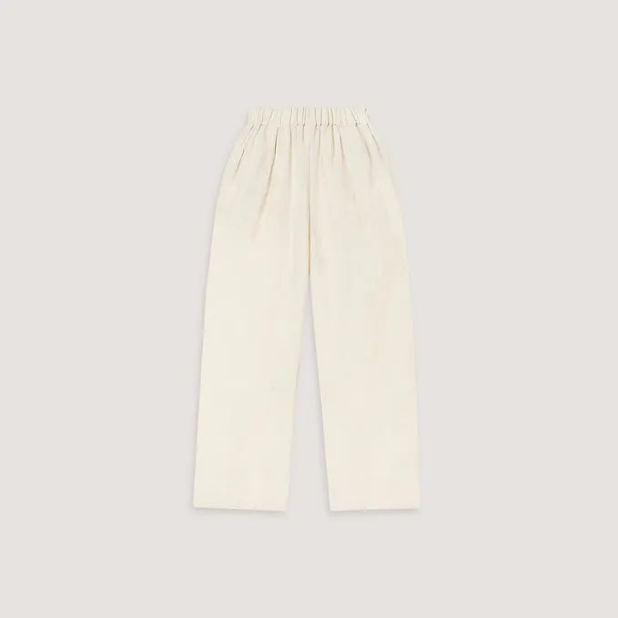 Woman wearing cream linen blend strapless blouse and wide-leg pants — Leo Lin | Endless UAE