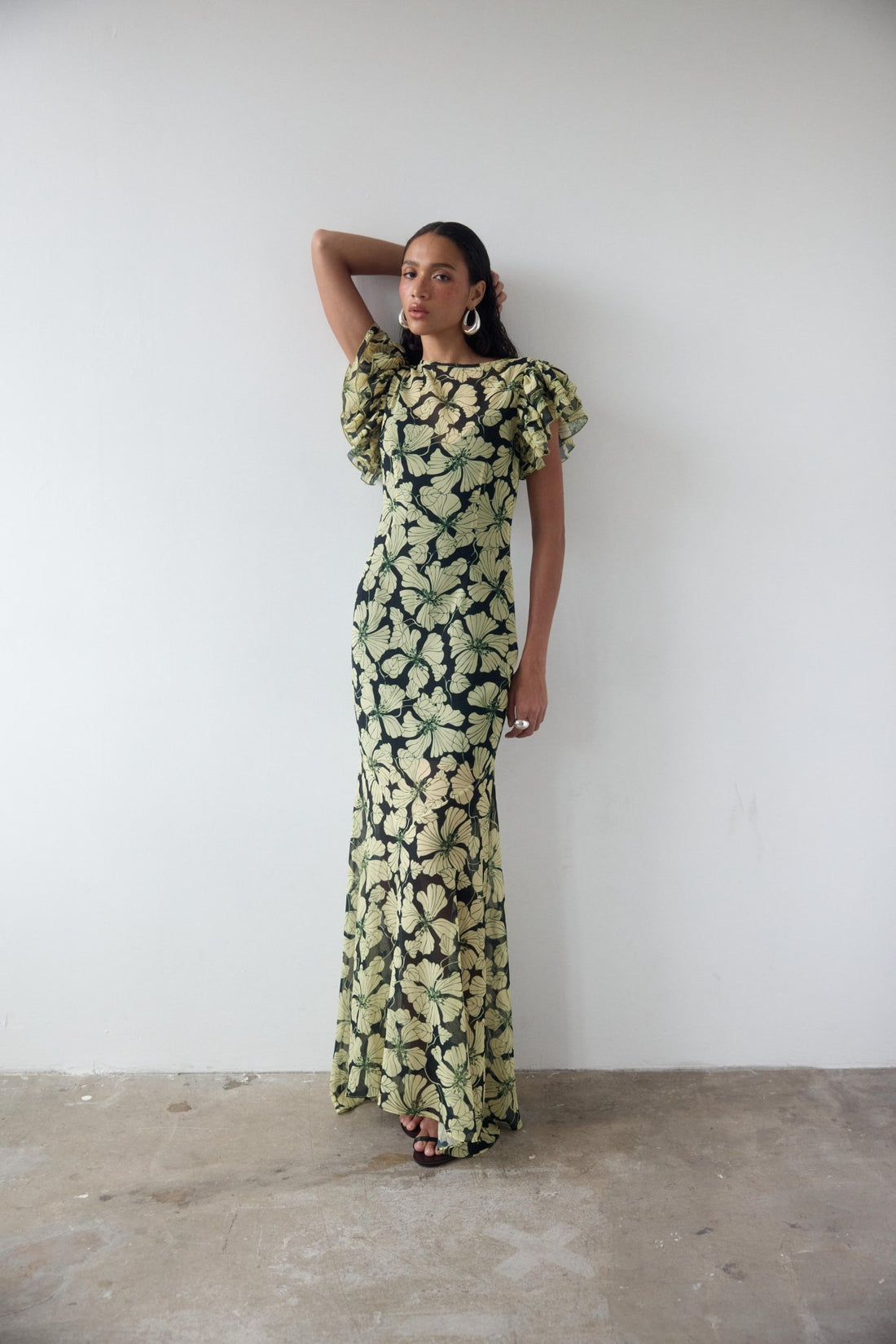 Bougainvillea Maxi Dress in cream and black floral print with ruffled sleeves — De La Vali | Endless UAE