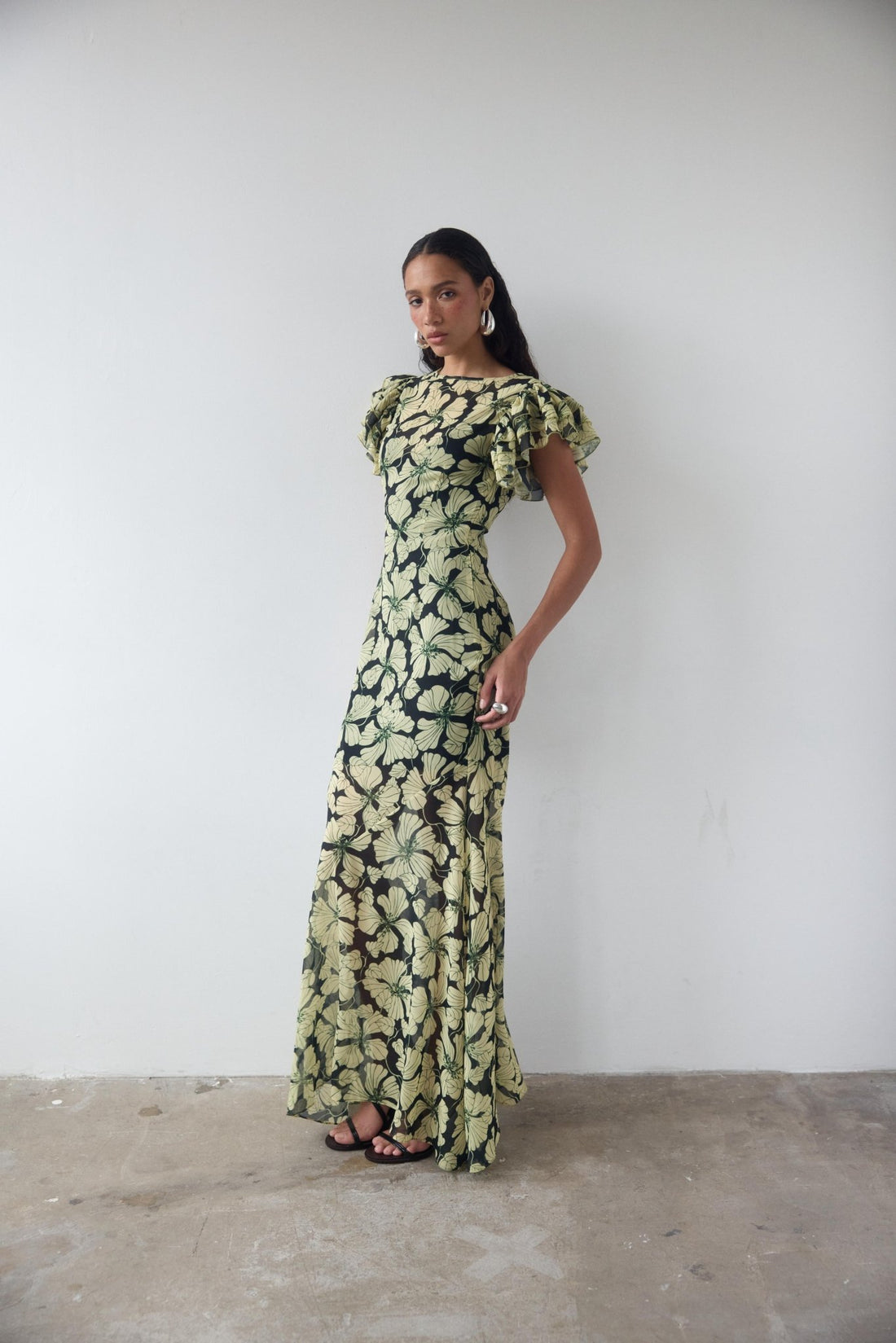 Bougainvillea Maxi Dress in cream and black floral print with ruffled sleeves — De La Vali | Endless UAE