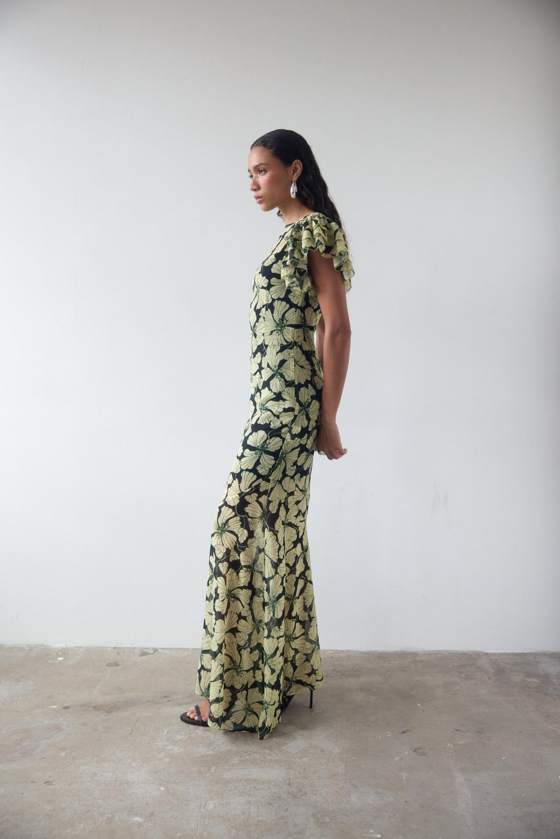 Bougainvillea Maxi Dress in cream and black floral print with ruffled sleeves — De La Vali | Endless UAE