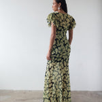 Bougainvillea Maxi Dress in cream and black floral print with ruffled sleeves — De La Vali | Endless UAE