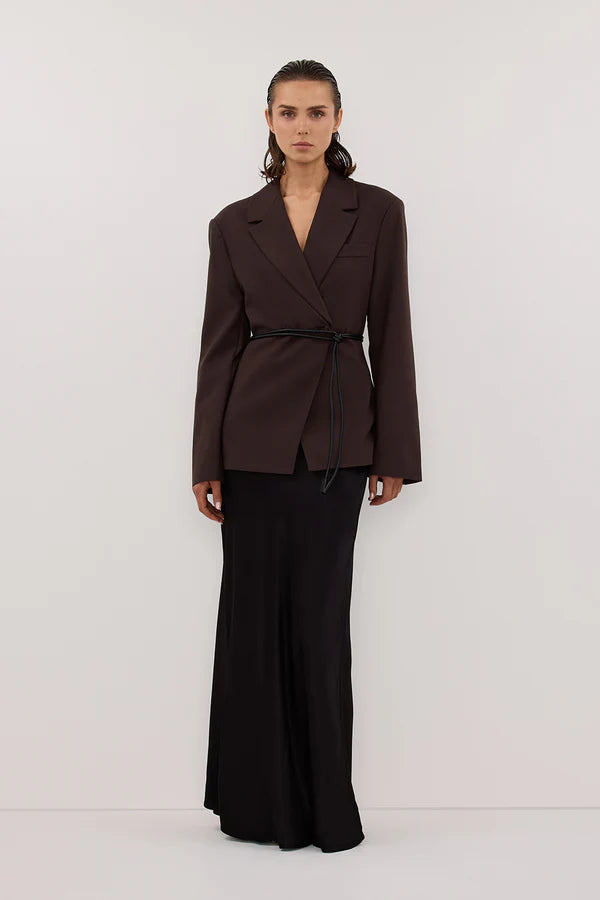 Woman wearing black sleeveless tank top and black satin maxi skirt — Dissh | Endless UAE