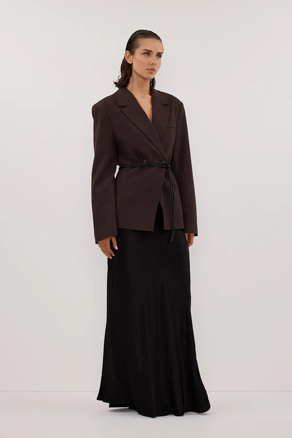 Woman wearing black sleeveless tank top and black satin maxi skirt — Dissh | Endless UAE