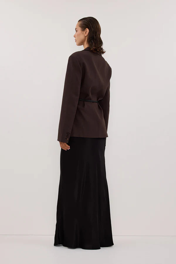 Woman wearing black sleeveless tank top and black satin maxi skirt — Dissh | Endless UAE