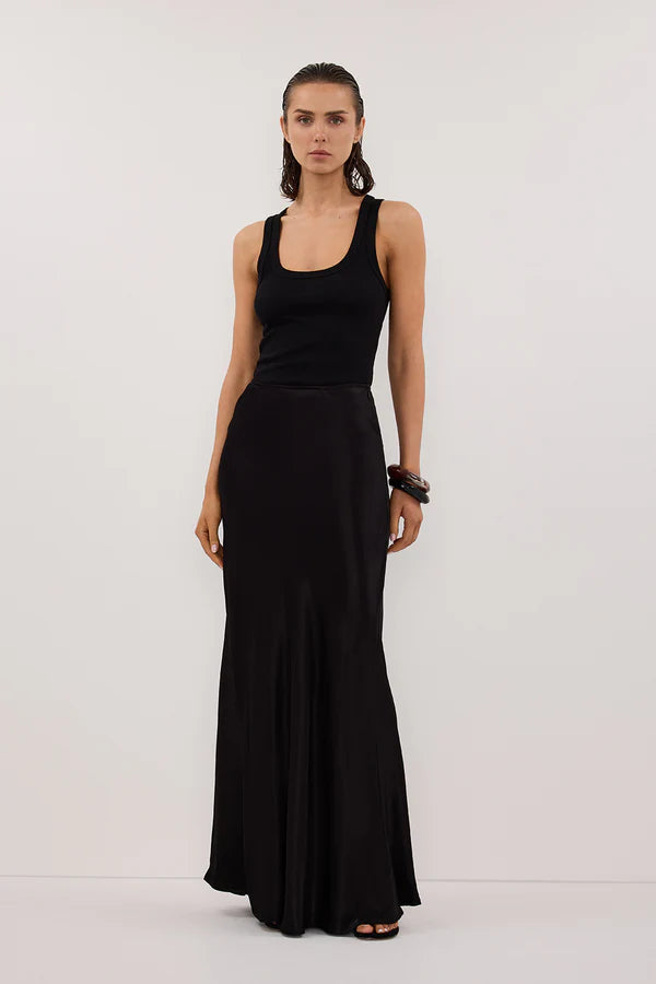 Woman wearing black sleeveless tank top and black satin maxi skirt — Dissh | Endless UAE