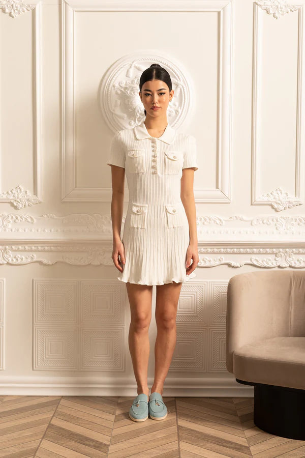 Elegant white short sleeve dress with ribbed texture, collar detail, and decorative pockets in a classic hourglass silhouette — Sierra Darien | Endless UAE