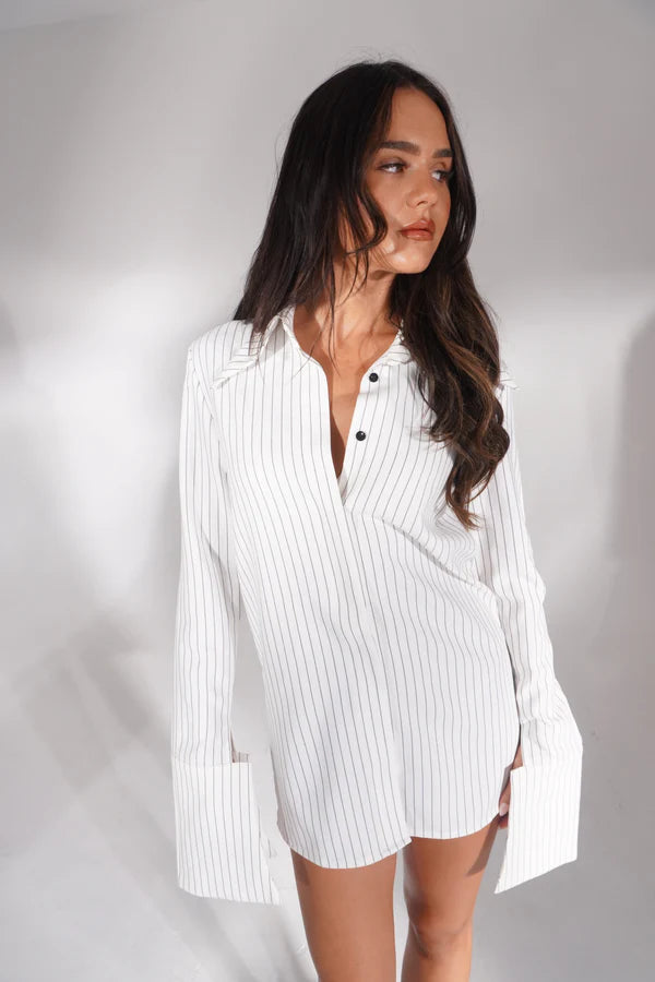 White pinstriped shirt dress styled as mini dress with pointed toe heels — Deme Studio | Endless UAE
