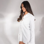 White pinstriped shirt dress styled as mini dress with pointed toe heels — Deme Studio | Endless UAE