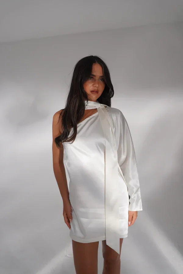 White one-shoulder mini dress with long sleeve on mannequin — Deme Studio | Endless UAE