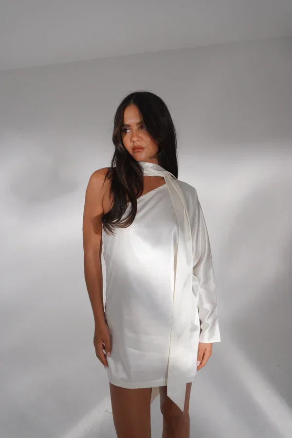 White one-shoulder mini dress with long sleeve on mannequin — Deme Studio | Endless UAE