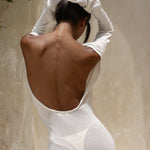 Strapless white tunic draped elegantly on model in sunlit architectural setting — Nuverance | Endless UAE
