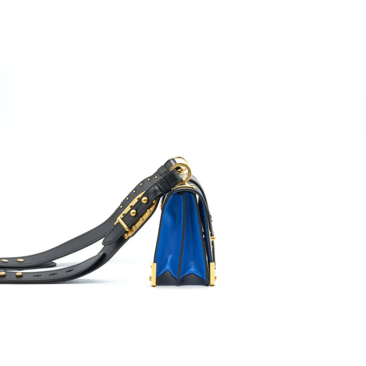 Blue and black leather Cahier crossbody bag with gold hardware and studded shoulder strap — Prada | Endless UAE