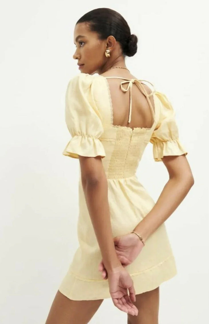 Evianna Linen Dress in pale yellow with square neckline and puff sleeves — Reformation | Endless UAE