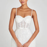 Elegant white mini dress with pearl embellishments, corset bodice, and sheer lace panel detail — Nadine Merabi | Endless UAE