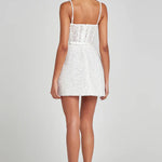 Short white sequin mini dress with thin straps worn from back view — Nadine Merabi | Endless UAE