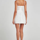 Short white sequin mini dress with thin straps worn from back view — Nadine Merabi | Endless UAE