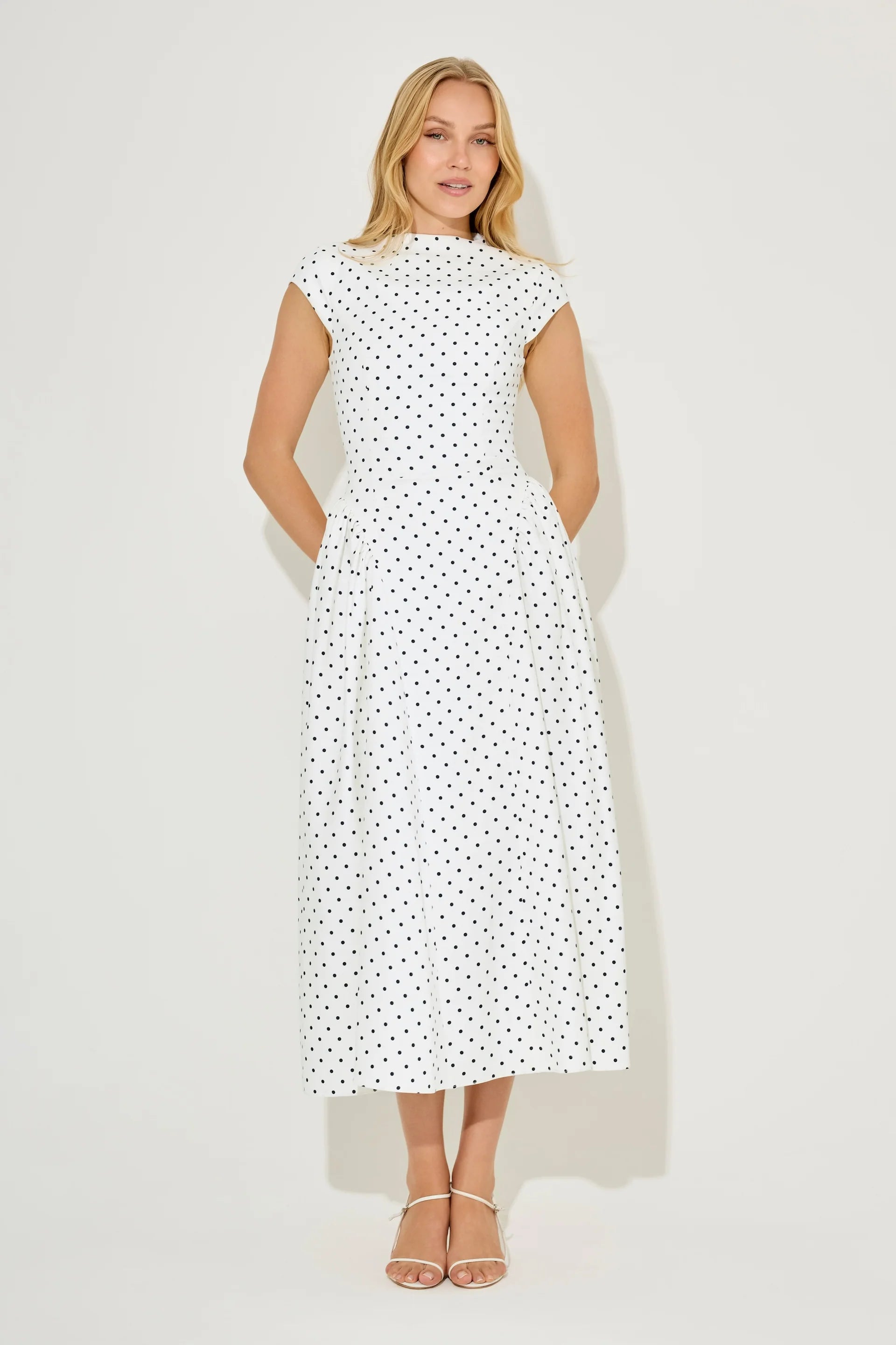 Woman wearing white polka dot cap sleeve gathered midi dress with pockets — Odd Muse | Endless UAE