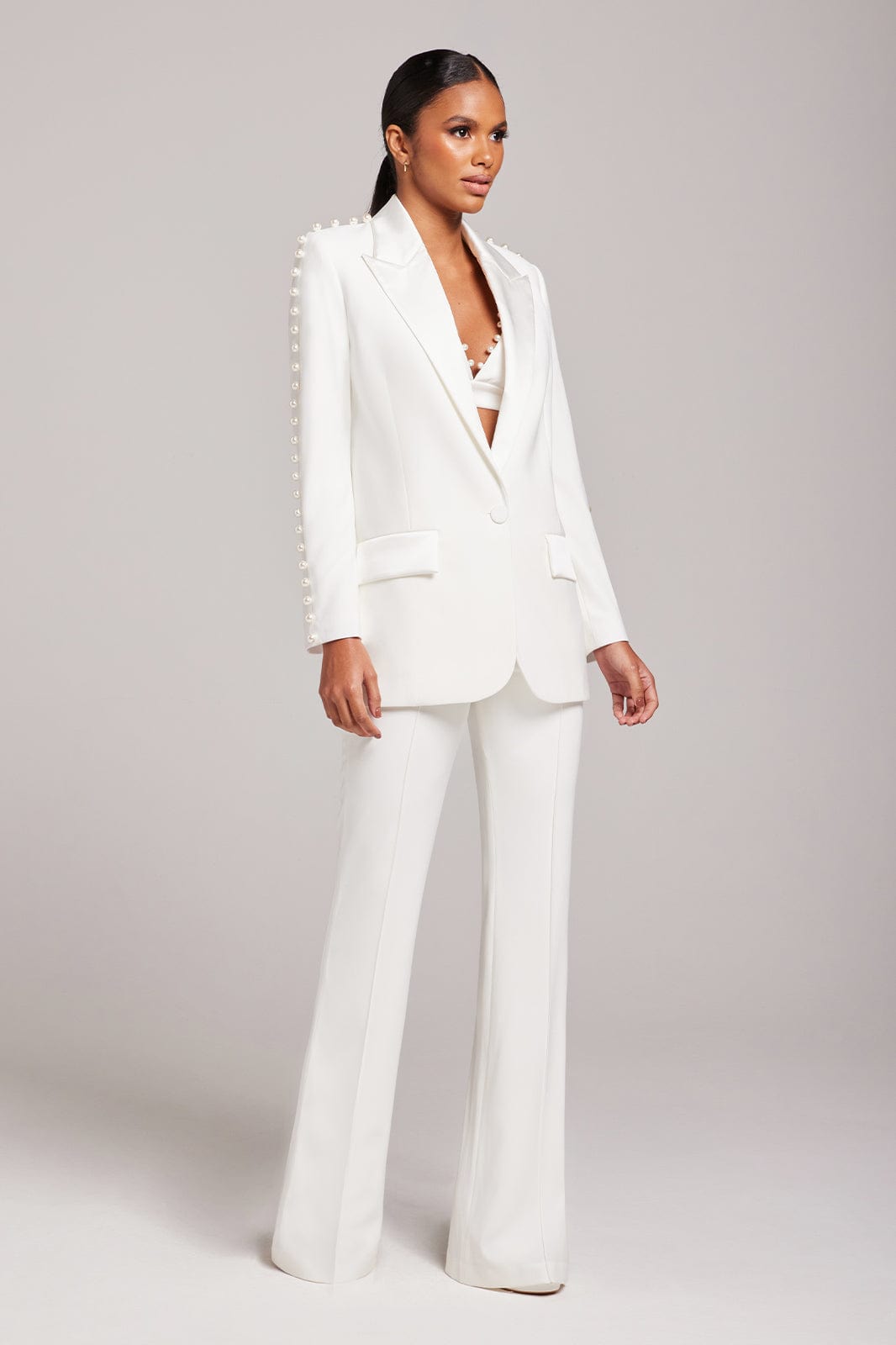 White pearl-embellished blazer and flared trousers co-ord set — Nadine Merabi | Endless UAE