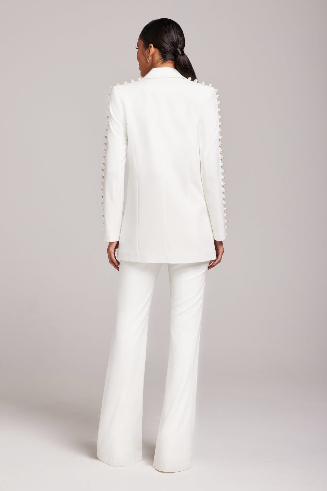 White pearl-embellished blazer and flared trousers co-ord set — Nadine Merabi | Endless UAE