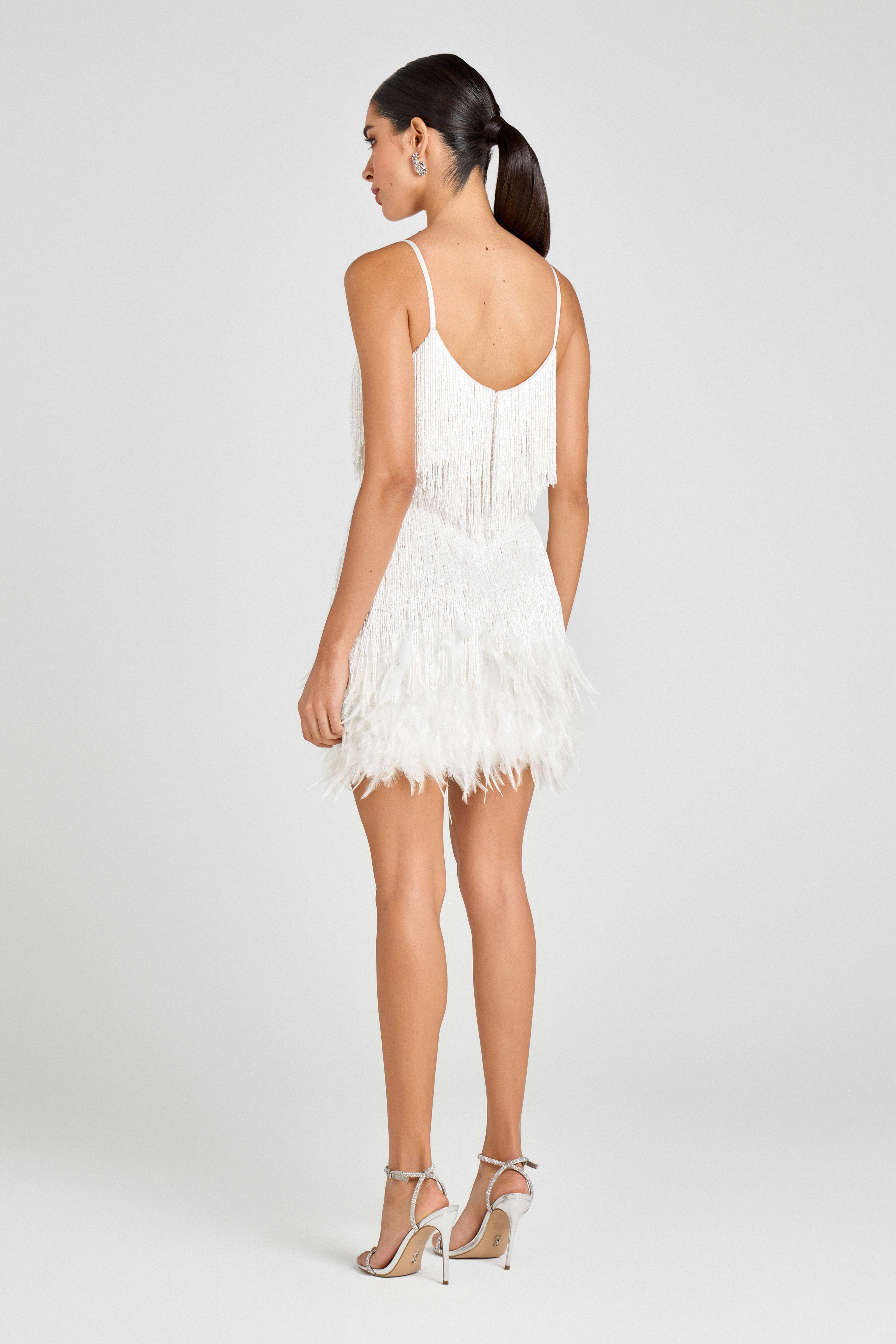 White fringed mini dress with layered tassel detailing — Nadine Merabi | Endless UAE