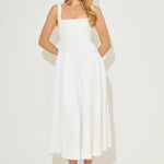 Woman wearing white square neck midi dress with pockets and strappy sandals — Odd Muse | Endless UAE