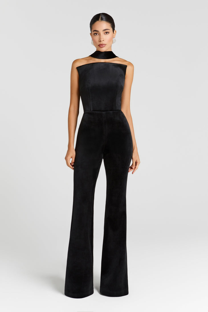 Black velvet jumpsuit with cutout neckline and wide-leg pants on model — Nadine Merabi | Endless UAE