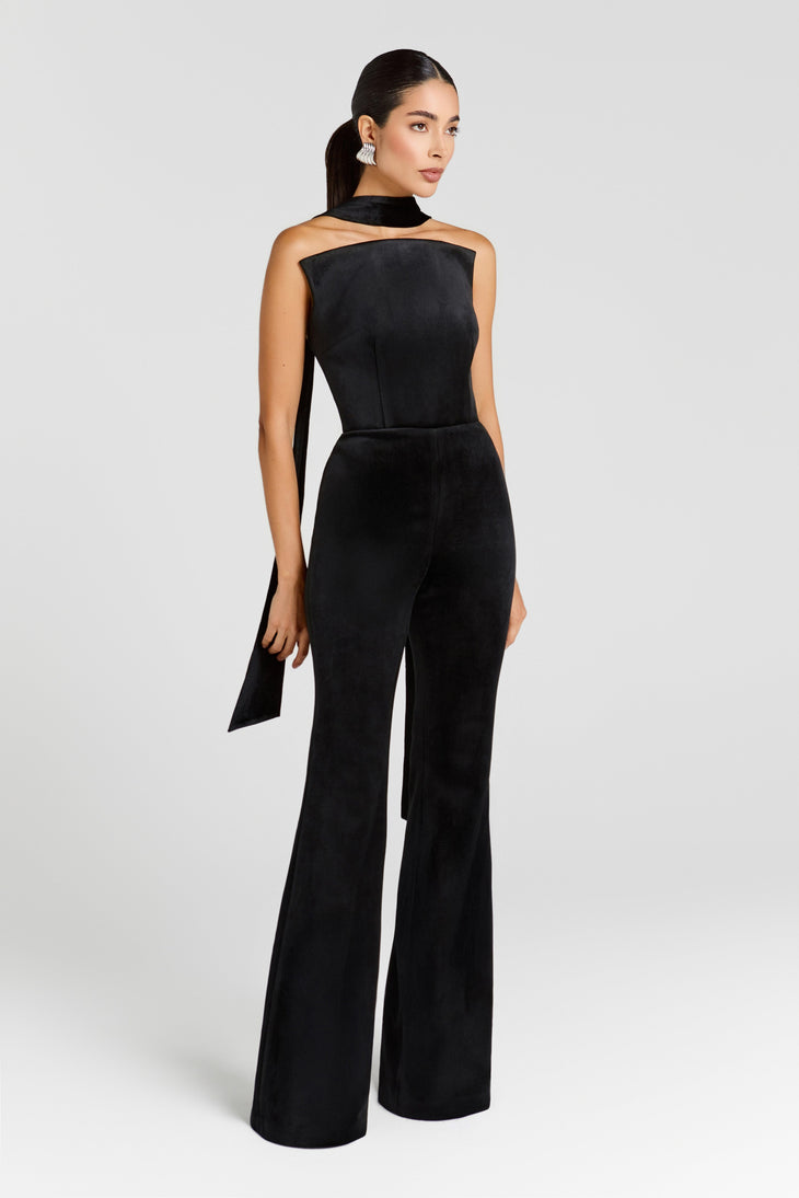 Black velvet halterneck jumpsuit with wide-leg pants and asymmetric scarf detail — Nadine Merabi | Endless UAE